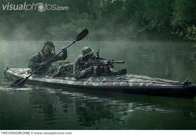 navy_seals_navigate_the_waters_in_a_folding_kayak_during_jungle_warfare_operations_TWE300002M.jpg